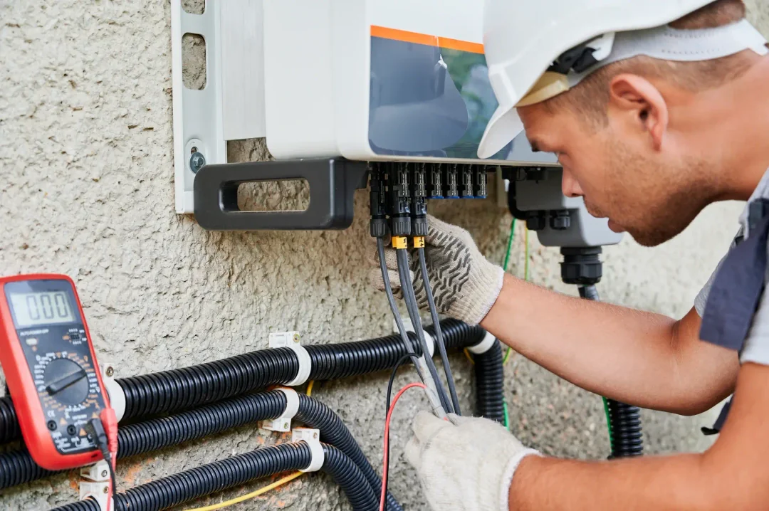Man working on solar energy system